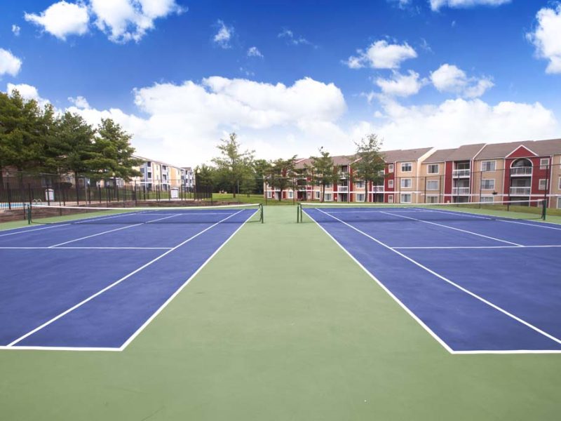 This image shows the two lighted tennis court in TGM Sudley Crossing that was ideal for sports recreation.